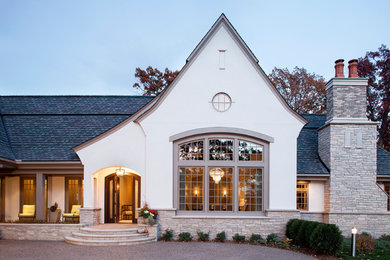 Traditional gray one-story stucco exterior home idea in Minneapolis