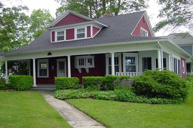 This is an example of a large and beige traditional two floor detached house in Detroit with wood cladding, a pitched roof and a shingle roof.