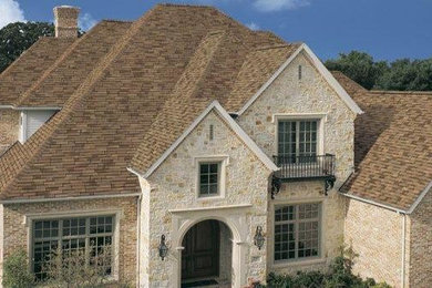 Large traditional brown two-story mixed siding gable roof idea in Oklahoma City