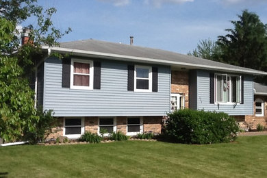 Exterior home idea in Cedar Rapids with a hip roof