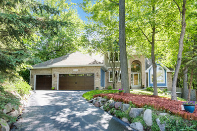 Inspiration for a large contemporary multicolored three-story mixed siding exterior home remodel in Minneapolis with a shingle roof