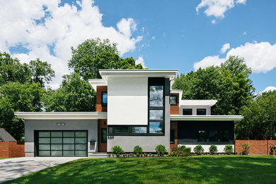 Großes, Zweistöckiges Modernes Einfamilienhaus mit grauer Fassadenfarbe, Flachdach und Betonfassade in New York