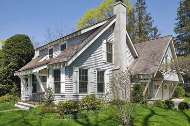Example of a small classic gray two-story wood exterior home design in Other with a shingle roof