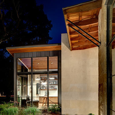 Inspiration for a contemporary mixed siding exterior home remodel in Dallas