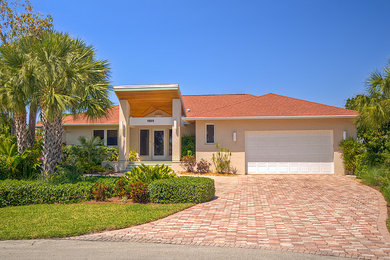 Example of a tuscan exterior home design in Miami