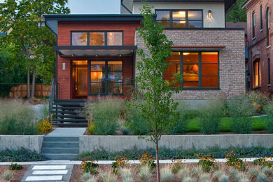 Large minimalist two-story brick exterior home photo in Salt Lake City