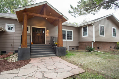 Example of an arts and crafts split-level exterior home design in Denver