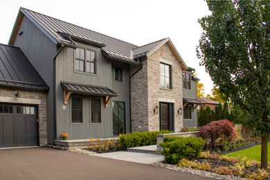 Example of a cottage exterior home design in Toronto