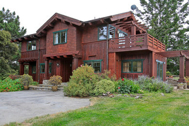 This is an example of a large and brown classic two floor house exterior in San Francisco with wood cladding and a pitched roof.