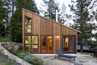 Trendy wood exterior home photo in San Francisco with a shed roof