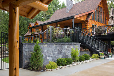 Example of a mid-sized trendy gray two-story stone exterior home design in New York