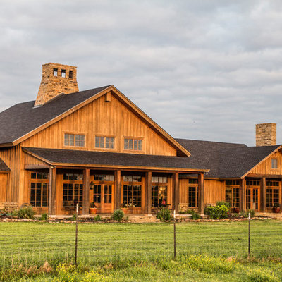 Large country wood gable roof photo in Houston