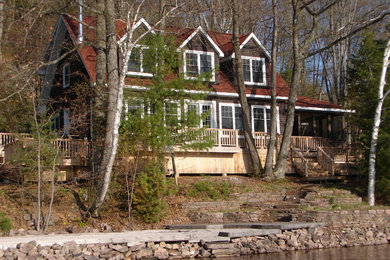 Mountain style three-story exterior home photo in Toronto