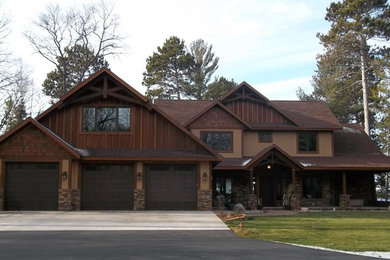 Example of a large mountain style brown two-story exterior home design in Minneapolis