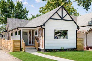 Mid-sized modern white one-story mixed siding house exterior idea in Indianapolis with a hip roof and a shingle roof