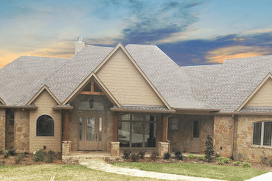 Inspiration for a rustic beige one-story house exterior remodel in Dallas