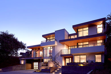 Inspiration for a large and white contemporary render house exterior in San Francisco with three floors and a flat roof.