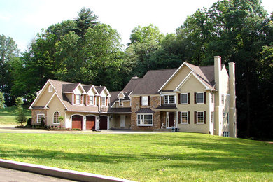 This is an example of a large and beige classic detached house in Philadelphia with three floors, mixed cladding, a pitched roof and a shingle roof.