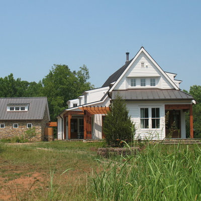 Example of a mid-sized farmhouse white two-story wood exterior home design in Richmond