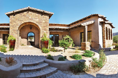 Example of a tuscan exterior home design in Phoenix