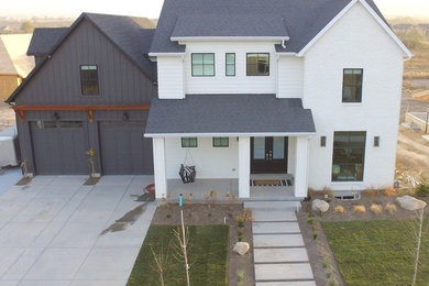 Example of a farmhouse white two-story concrete fiberboard gable roof design in Salt Lake City