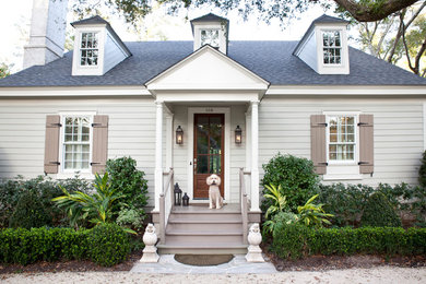Example of a large classic white two-story vinyl house exterior design in Atlanta with a hip roof and a shingle roof