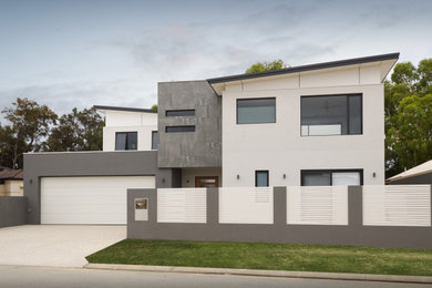 Modelo de fachada de casa gris minimalista grande de dos plantas con revestimiento de piedra, techo de mariposa y tejado de metal