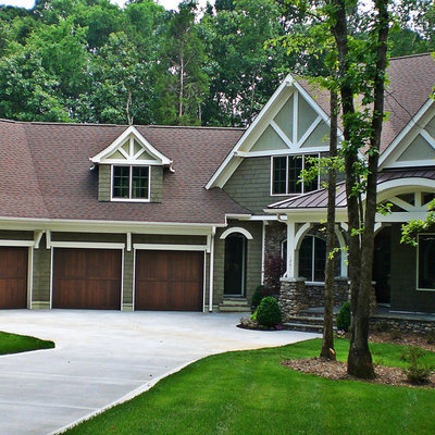 Example of a mid-sized classic green two-story mixed siding gable roof design in Charlotte