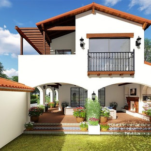 Mid-sized tuscan white two-story stucco exterior home photo in Los Angeles with a tile roof
