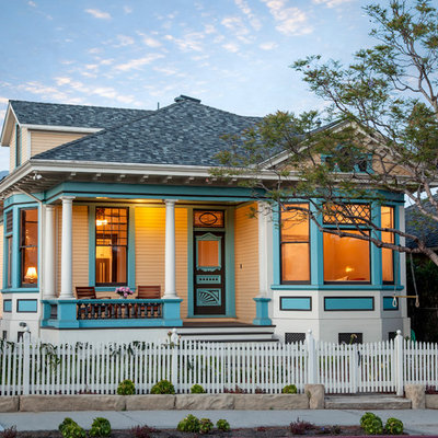 Example of a mid-sized ornate white two-story wood exterior home design in Santa Barbara