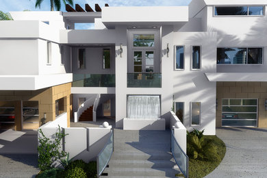 Esempio della facciata di una casa grande moderna a tre piani con tetto piano