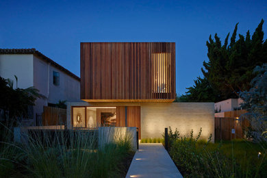 Large minimalist gray two-story mixed siding flat roof photo in Los Angeles