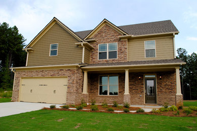 Large craftsman beige two-story mixed siding exterior home idea in Atlanta with a shingle roof