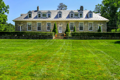 Inspiration for a large timeless two-story stone exterior home remodel in Baltimore