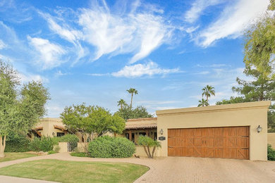 Example of a transitional exterior home design in Phoenix