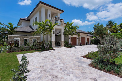 Example of a transitional white two-story stone exterior home design in Tampa