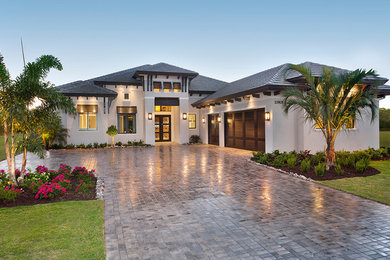 Inspiration for a transitional white one-story house exterior remodel in Other with a tile roof