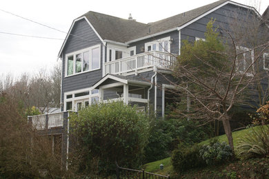 Inspiration for a mid-sized timeless gray three-story wood exterior home remodel in Seattle