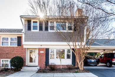Mid-sized elegant multicolored split-level mixed siding exterior home photo in DC Metro with a shingle roof