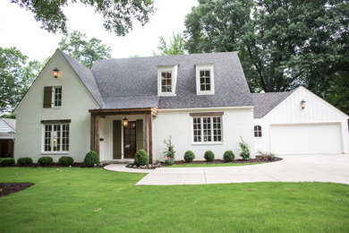 Elegant white two-story brick exterior home photo in Other