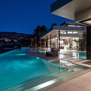 Large contemporary one-storey stucco white house exterior in Las Vegas with a flat roof.