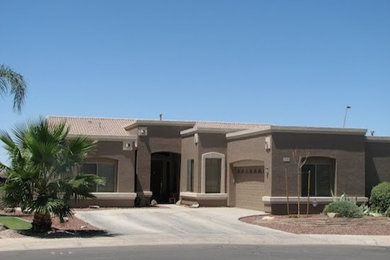 Example of a small southwest beige one-story stucco exterior home design in Denver