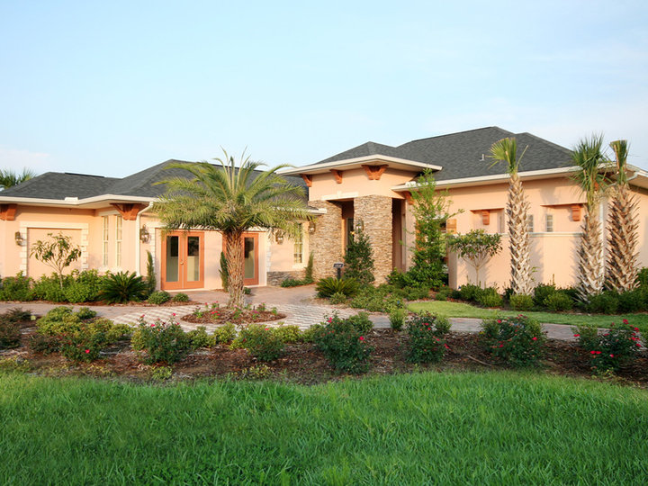 Mid-sized mediterranean beige one-story stucco exterior home idea