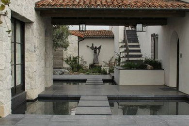 Inspiration for a mediterranean house exterior in Orange County.