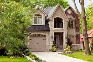 Inspiration for a two-story stone exterior home remodel in Other