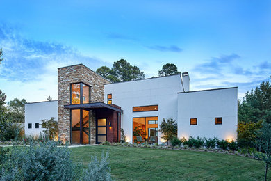 Photo of a white contemporary two floor detached house in Dallas with mixed cladding and a flat roof.