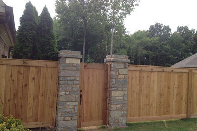 Shea rd cedar fence with stone pillars