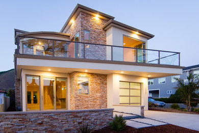 Inspiration for a mid-sized contemporary white two-story mixed siding flat roof remodel in San Luis Obispo