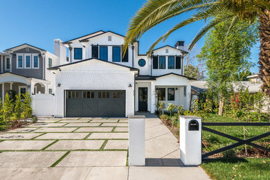 Mid-sized transitional multicolored two-story wood exterior home photo in Los Angeles with a shingle roof