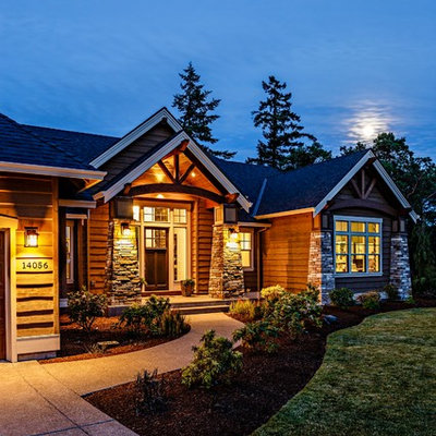 Inspiration for a mid-sized craftsman brown two-story mixed siding gable roof remodel in Portland